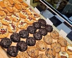 Assorted pastries and cookies in the display at La Bonbonnière Bakery.