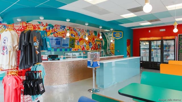 The turquoise Seemingly Overzealous ice cream counter and illustrated mural inside the Plaza Midwood shop in Charlotte.