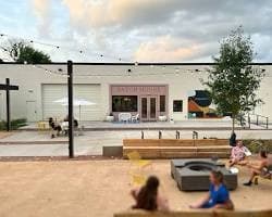 The Batch House storefront overlooking an outdoor courtyard with seating.