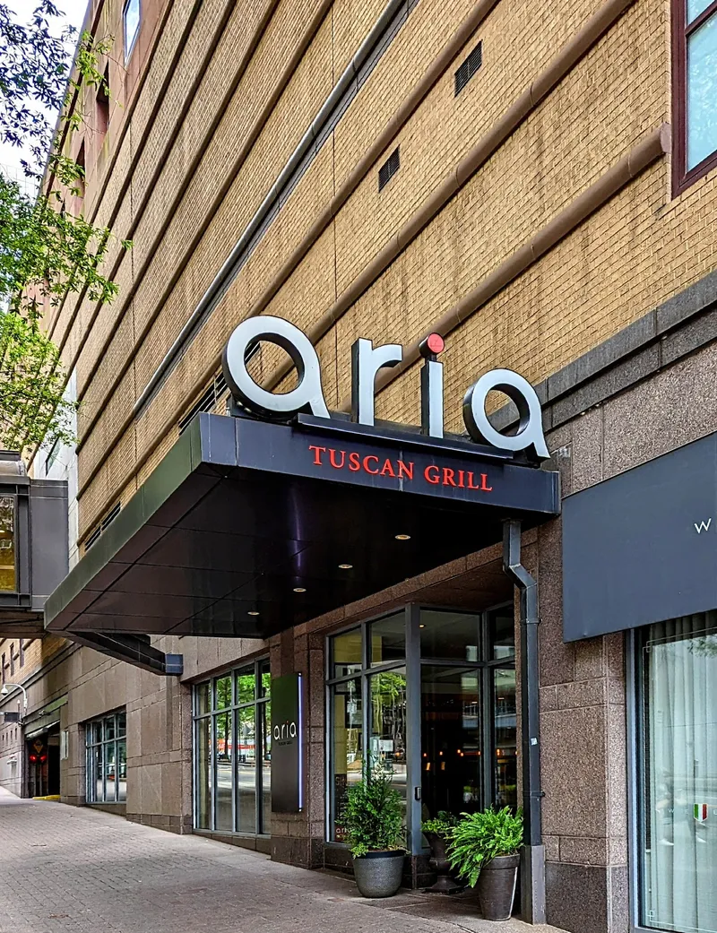 Aria Tuscan Grill’s exterior sign and entrance in Uptown Charlotte