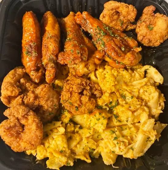 Wings and macaroni and cheese at Cuzzo’s Cuisine II in Charlotte