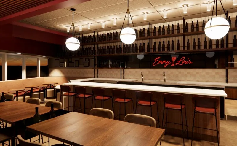 The wooden bar and tables at Emmy Lou’s in Charlotte