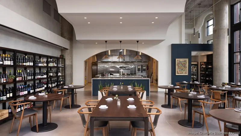 Dining tables and wine shelves at L’Ostrica in Charlotte