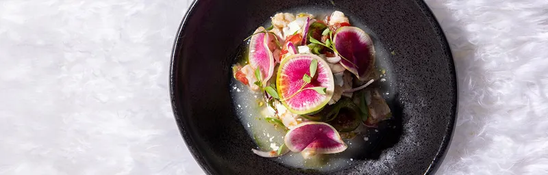 A plated dish with vegetables at Mariposa in Charlotte