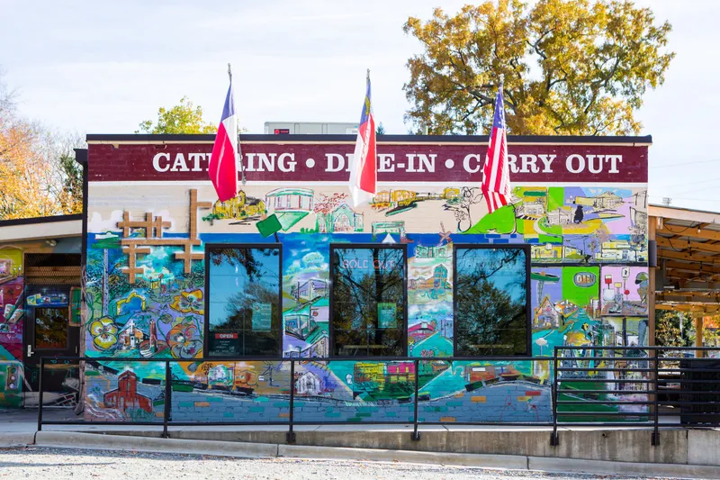 Sweet Lew’s BBQ’s colorful exterior and mural in Charlotte