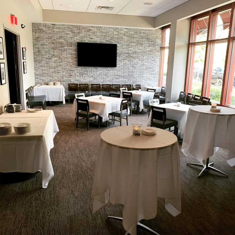 Dining tables and white tablecloths at The Porter’s House in Charlotte